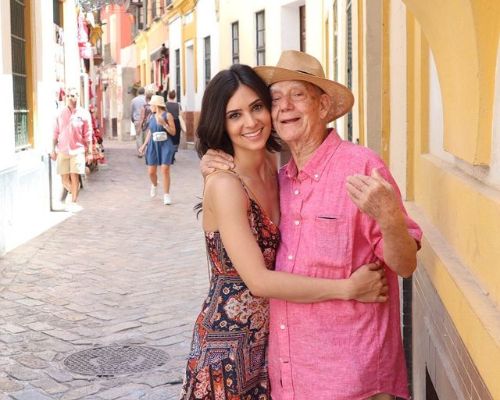 Camila Banus posing with her grandfathe